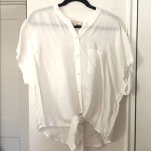 White LoveStitch blouse with tie bottom